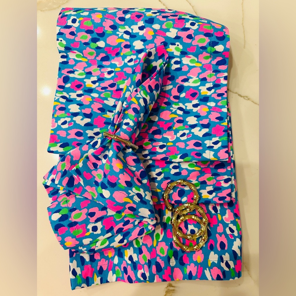 Lilly Pulitzer cloth dinner napkins and gold faux bamboo napkin rings.